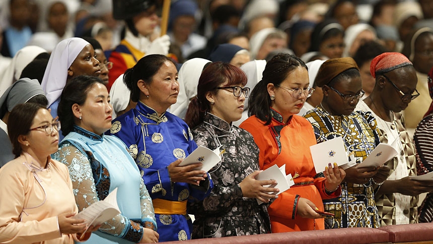 People attend a prayer vigil led by Pope Francis to open a month dedicated to missionaries, in St. Peter's Basilica at the Vatican Oct. 1, 2019. (CNS photo/Paul Haring) See POPE-MISSIONARY-VESPERS Oct. 1, 2019.