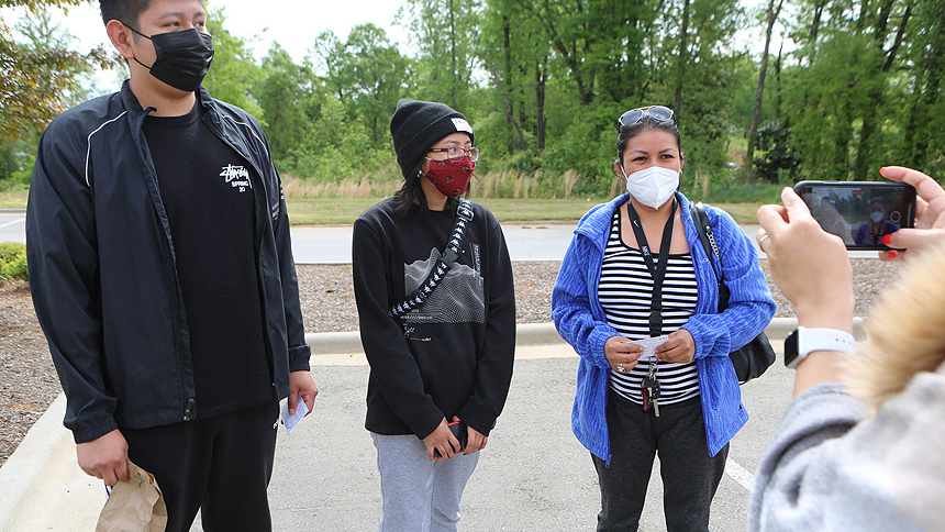 Adela Gonzales (right), along with her children Tony and Jennifer, share their thoughts on the vaccine.