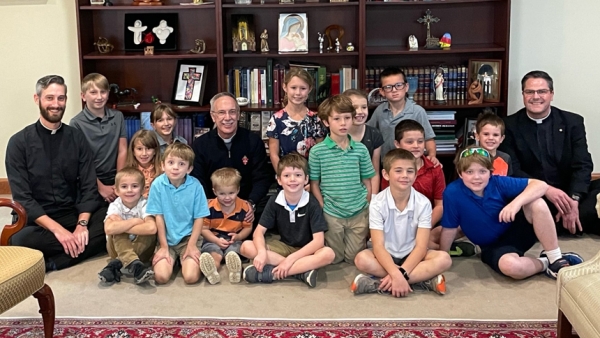 Homeschool group visits diocesan offices, bishop