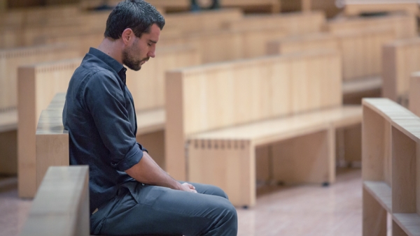 Man praying in church