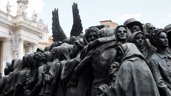 A detail is seen of "Angels Unawares," a sculpture by Canadian Timothy Schmalz in St. Peter's Square at the Vatican, June 3, 2024. The sculpture depicts a boat with 140 figures of migrants from various historical periods and various nations. (CNS photo/Lola Gomez)